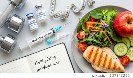 Healthy eating and weight loss injection flat lay with salad, grilled chicken and dumbbell for diet background and wellness design Healthy eating and weight loss injection flat lay with salad, grilled chicken and dumbbell for diet background and wellness design 137542296