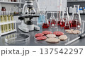 Laboratory cultured meat production setup with petri dishes, test tubes and microscope for food research and innovation background 137542297