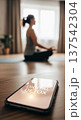 Indoor meditation scene with smartphone showing digital detox message for home wellness background and mindfulness practice 137542304