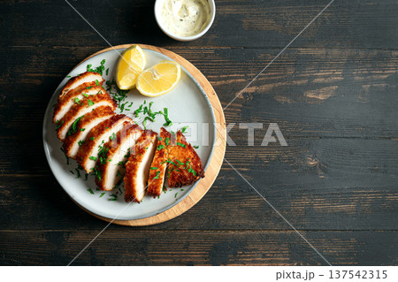 Air fryed chicken meat with herbs and lemon 137542315