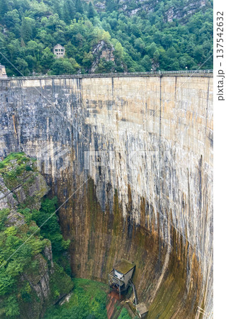 A dam surrounded by mountains and green highlands in Cantabria, Spain. 137542632