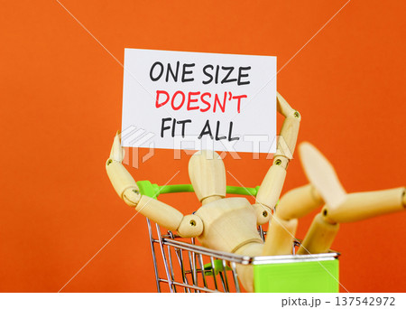 One size does not fit all symbol. Concept words One size does not fit all on beautiful white paper. Beautiful orange background. Business one size does not fit all concept. Copy space. 137542972