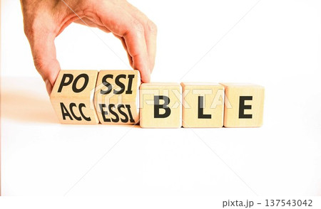 Accessible or possible symbol. Concept words Accessible or Possible on beautiful wooden blocks. Beautiful white background. Doctor's hand. Business accessible or possible concept. Copy space. Accessible or possible symbol. Concept words Accessible or Possible on beautiful wooden blocks. Beautiful white background. Doctor's hand. Business accessible or possible concept. Copy space. 137543042