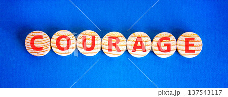 Courage symbol. Concept word Courage on beautiful wooden circles. Beautiful blue background. Business courage concept. Copy space. Courage symbol. Concept word Courage on beautiful wooden circles. Beautiful blue background. Business courage concept. Copy space. 137543117
