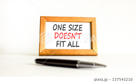 One size does not fit all symbol. Concept words One size does not fit all on beautiful wooden picture frame. Beautiful white background. Business one size does not fit all concept. Copy space. One size does not fit all symbol. Concept words One size does not fit all on beautiful wooden picture frame. Beautiful white background. Business one size does not fit all concept. Copy space. 137543210