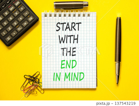 Start with the end in mind symbol. Concept words Start with the end in mind on beautiful note. Beautiful yellow background. Black calculator. Business start with the end in mind concept. Copy space 137543219