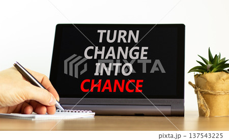 Turn change into chance symbol. Concept words phrase Turn change into chance on beautiful tablet. Businessman's hand. Beautiful white background. Business Turn change into chance concept. Copy space. Turn change into chance symbol. Concept words phrase Turn change into chance on beautiful tablet. Businessman's hand. Beautiful white background. Business Turn change into chance concept. Copy space. 137543225