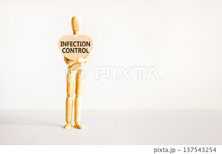 Infection control symbol. Concept words Infection control on beautiful wooden heart. Doctor's model. Beautiful white background. Copy space. Medical healthy lifestyle infection control concept. 137543254