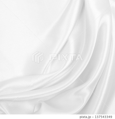 Smooth elegant white silk or satin luxury cloth texture as wedding background. Luxurious background design Smooth elegant white silk or satin luxury cloth texture as wedding background. Luxurious background design 137543349