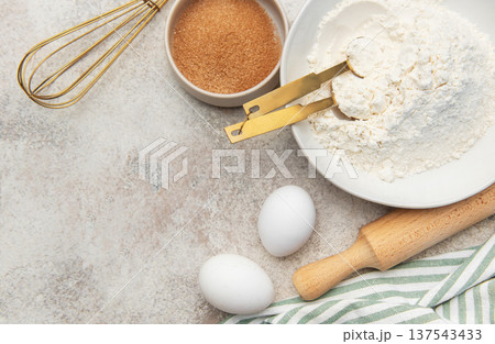 Baking ingredients preparing dough on kitchen counter 137543433