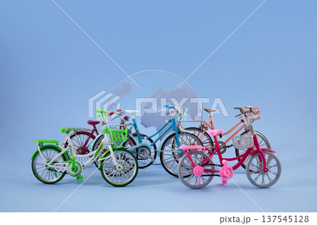 World Bicycle day. Bicycles in front of globe representing global sustainable transport World Bicycle day. Bicycles in front of globe representing global sustainable transport 137545128
