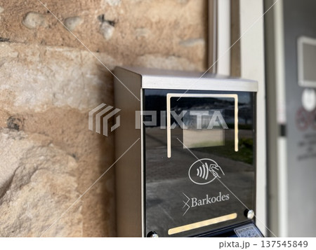 Electronic access control system with contactless reader installed on stone wall Electronic access control system with contactless reader installed on stone wall 137545849