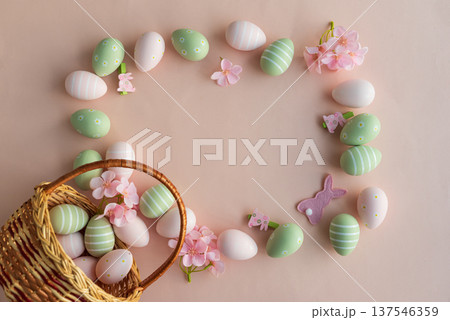 Frame made from Easter Basket with Pastel Eggs, Flowers and Bunny Decorations. Festive Spring Flatlay Frame made from Easter Basket with Pastel Eggs, Flowers and Bunny Decorations. Festive Spring Flatlay 137546359