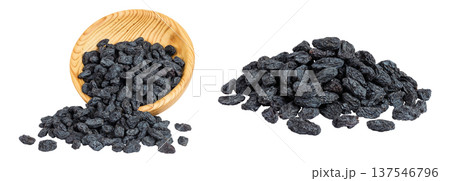 black raisins in wooden bowl isolated on white background black raisins in wooden bowl isolated on white background 137546796
