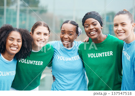 Happy women, portrait and volunteers in sports fitness, netball or outdoor exercise together for community. Group of athletic players smile and hug in team sport, motivation or volunteering on court Happy women, portrait and volunteers in sports fitness, netball or outdoor exercise together for community. Group of athletic players smile and hug in team sport, motivation or volunteering on court 137547518