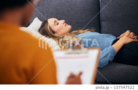 Therapy, sofa and woman relax in counselling for mental health, help for depression and listen to communication. Psychologist, consultation and patient lying on couch, writing notes and sleep comfort Therapy, sofa and woman relax in counselling for mental health, help for depression and listen to communication. Psychologist, consultation and patient lying on couch, writing notes and sleep comfort 137547522