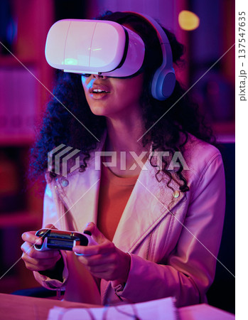 VR, glasses and woman, gaming developer and programmer test game software, futuristic technology and neon light in office. Information technology professional or gamer with virtual reality at night VR, glasses and woman, gaming developer and programmer test game software, futuristic technology and neon light in office. Information technology professional or gamer with virtual reality at night 137547635