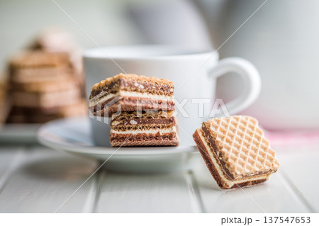 Stacked Chocolate Wafer Cookies With Coffee Cup on Plate. Sweet Crunchy Dessert Snack 137547653