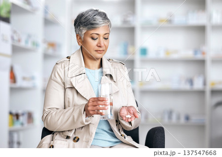 Pharmacy, medicine and pills with senior woman in store for healthcare, prescription and supplements. Medical, product and wellness with customer and prescription for vitamins, sick and treatment Pharmacy, medicine and pills with senior woman in store for healthcare, prescription and supplements. Medical, product and wellness with customer and prescription for vitamins, sick and treatment 137547668