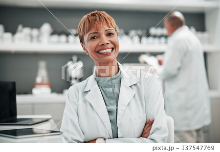 Portrait, science and arms crossed with a woman doctor in the laboratory for research, innovation or breakthrough. Medical, study and smile with a mature scientist working in a pharmaceutical lab 137547769