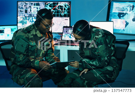 Military control room, tablet or team monitor CCTV, army database server or online surveillance system. Data center, soldier collaboration or people teamwork on crime report, safety or security intel Military control room, tablet or team monitor CCTV, army database server or online surveillance system. Data center, soldier collaboration or people teamwork on crime report, safety or security intel 137547773