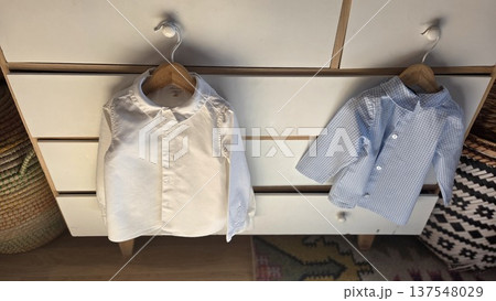 Children's clothing hanging on wardrobe for fashion and storage organization Children's clothing hanging on wardrobe for fashion and storage organization 137548029