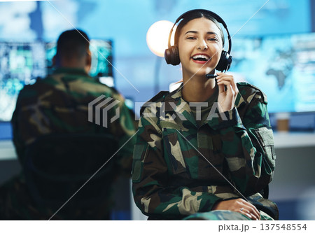 Portrait, headset and a woman in a military control room for strategy as a soldier in uniform during war or battle. Face, smile and young army person in an office for support, surveillance or service 137548554