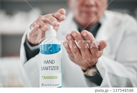 Doctor, sanitizer bottle and cleaning hands for risk, hygiene and protocol in hospital, clinic and surgery. Closeup, healthcare worker and disinfection liquid for safety, flu germs and virus bacteria 137548586