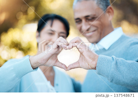 Hands, heart and emoji with a senior couple outdoor in celebration of their love or anniversary together. Hope, trust or peace with an elderly man and woman closeup for freedom or romance in summer Hands, heart and emoji with a senior couple outdoor in celebration of their love or anniversary together. Hope, trust or peace with an elderly man and woman closeup for freedom or romance in summer 137548671
