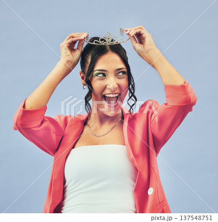 Fashion, beauty and woman with crown in studio for glamour, luxury and winning prize. Excited, wow and isolated person with tiara for princess pride, confidence and cosmetics on purple background 137548751
