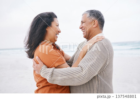 Hug, beach and elderly couple laugh at funny conversation, retirement joke or anniversary humour in Mexico. Tropical winter date, comedy and romantic man, mature woman or people bond, embrace or care 137548801