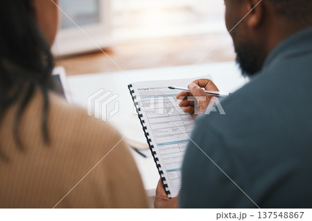 Couple, mortgage paperwork and loan application with finance, investment and property opportunity. People apply for new home together, writing on documents and information, back view with real estate Couple, mortgage paperwork and loan application with finance, investment and property opportunity. People apply for new home together, writing on documents and information, back view with real estate 137548867