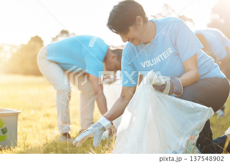 Nature recycling, community service volunteer and happy woman cleaning garbage, trash or pollution. Earth Day teamwork, eco friendly environment and charity team help with sustainable park clean up Nature recycling, community service volunteer and happy woman cleaning garbage, trash or pollution. Earth Day teamwork, eco friendly environment and charity team help with sustainable park clean up 137548902