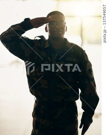 Confident soldier portrait, army and salute in building with pride, professional hero and night service. Military career, security and courage, black man in camouflage uniform at government agency. 137549057