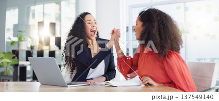 Laptop, success and business women high five to celebrate goals, targets or achievement in office. Winner, wow surprise and happy friends or employees in celebration of winning, promotion and bonus. 137549140