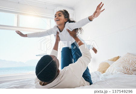 Airplane, love and father with girl child on a bed for bond, trust or support in their home together. Flying, family time and parent with kid in a bedroom for games, play or fun with weekend freedom Airplane, love and father with girl child on a bed for bond, trust or support in their home together. Flying, family time and parent with kid in a bedroom for games, play or fun with weekend freedom 137549296