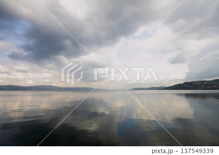 clouds reflected in the lake clouds reflected in the lake 137549339