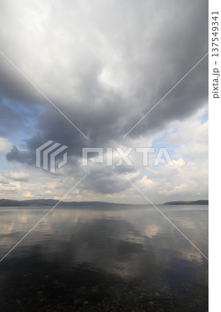 clouds reflected in the lake clouds reflected in the lake 137549341