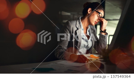 Business, night and woman with a headache, overlay and overworked with financial audit, tax and pain. Person, employee and worker with a migraine, tired and burnout with stress, dark and frustrated 137549364