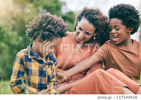 Happy, playful and mother with children in park for relax, bonding and love. Care, support and smile with woman and kids in grass field in nature for black family, summer and happiness together 137549426