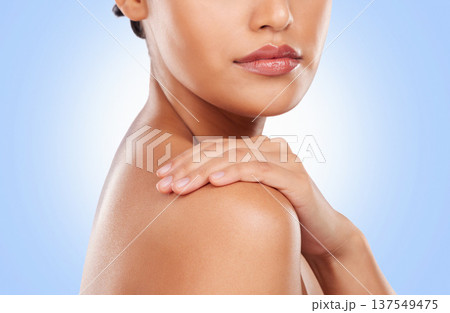 Beauty, skincare and shoulder of woman on blue background for wellness, satisfaction and healthy skin. Luxury spa, aesthetic and closeup of person in studio for dermatology, cosmetics and self care Beauty, skincare and shoulder of woman on blue background for wellness, satisfaction and healthy skin. Luxury spa, aesthetic and closeup of person in studio for dermatology, cosmetics and self care 137549475