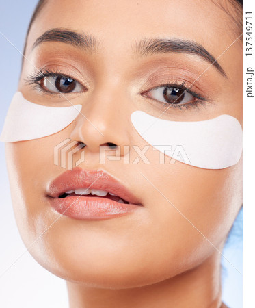 Portrait, beauty and woman with collagen patch for anti aging or skin glow on studio background. Cosmetics, facial detox and face of model with eye pads or skincare patch for dermatology product. Portrait, beauty and woman with collagen patch for anti aging or skin glow on studio background. Cosmetics, facial detox and face of model with eye pads or skincare patch for dermatology product. 137549711