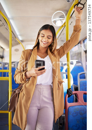 Bus, happy woman and phone with public transport, social media scroll and smile with business commute. City travel, stop and internet app of a female professional on a mobile with networking on metro Bus, happy woman and phone with public transport, social media scroll and smile with business commute. City travel, stop and internet app of a female professional on a mobile with networking on metro 137549734