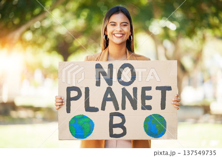 Woman, poster and climate change sign at park for earth, environment and green or eco friendly protest. Young person in portrait and nature, planet or globe support for sustainable world and action 137549735
