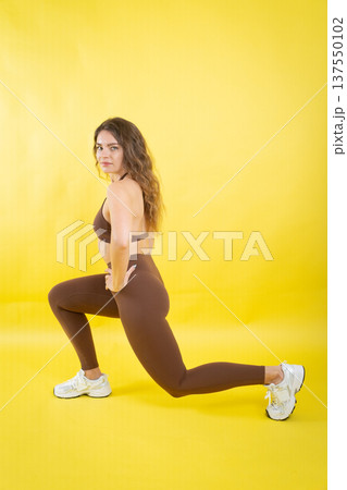 Woman exercising lunge for fitness and workout training Woman exercising lunge for fitness and workout training 137550102