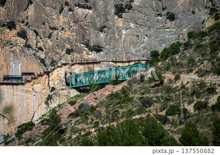 Caminito del Rey, The King's Path. Walkway pinned along the steep walls of a narrow gorge in Andales, Spain Caminito del Rey, The King's Path. Walkway pinned along the steep walls of a narrow gorge in Andales, Spain 137550882