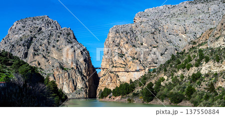Caminito del Rey, The King's Path. Walkway pinned along the steep walls of a narrow gorge in Andales, Spain Caminito del Rey, The King's Path. Walkway pinned along the steep walls of a narrow gorge in Andales, Spain 137550884