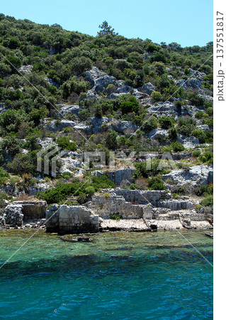 A small seaside town Antalya. Flooded ancient Lycian city as a result of the earthquake city. Near the city of Simena in the vicinity of Kekova Turkey. A small seaside town Antalya. Flooded ancient Lycian city as a result of the earthquake city. Near the city of Simena in the vicinity of Kekova Turkey. 137551817