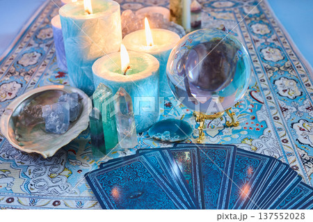 Tarot cards, crystal ball, candles, and spiritual healing items 137552028