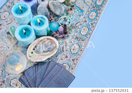 Blue candles, crystals, and tarot cards for divination Blue candles, crystals, and tarot cards for divination 137552031